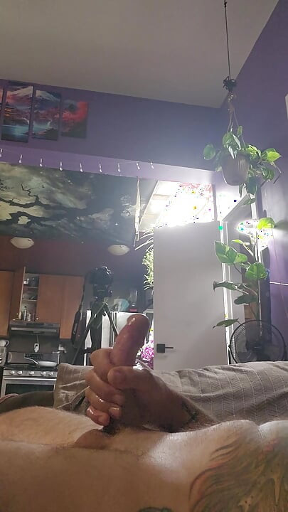 close up of big cock lubed up being stroked till it cum