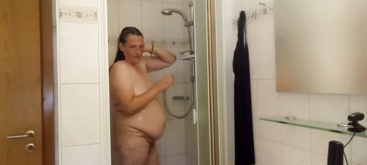 Chubby mature woman in the shower – soft belly – part 2