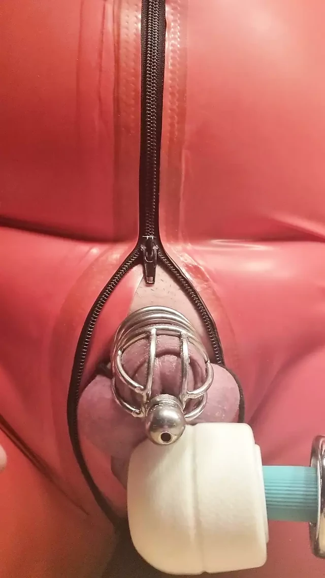 Milked the penis cage in a latex catsuit with MagicWand