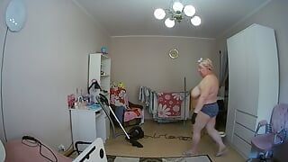 mother-in-law cleans the room naked