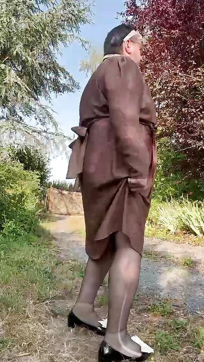 Wearing a brown Portefeuille-style dress for an evening