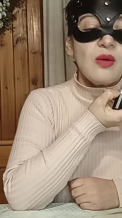 Maggy Applies Lipstick