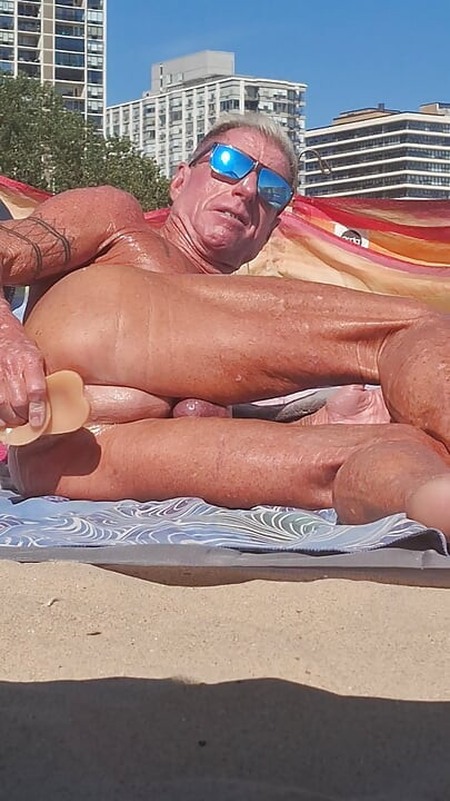 Key West oiled up using his new larger dildo at the beach