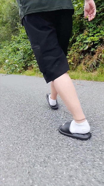 In Slippers and White Socks in Nature