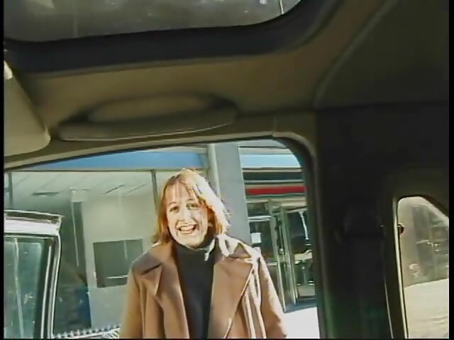 Commuter redhead carpools with creep who debases her in car in city traffic