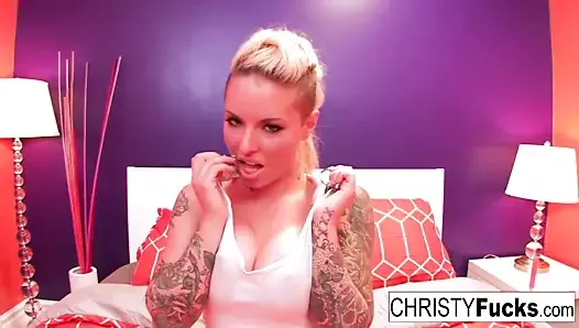 Curvy tattooed starlet Christy uses a toy on her tight pussy