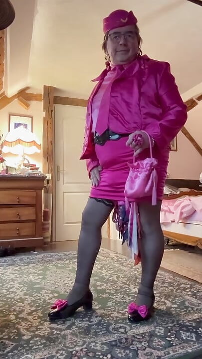 Dressed in a fuchsia miniskirt for her flight attendant party