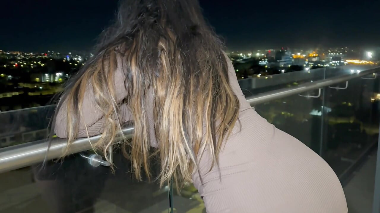 A horny Mexican woman fucks her hot stepbrother on the balcony of their house, flashing her huge breasts in the open air!