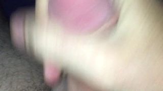 Stroking cock in bed