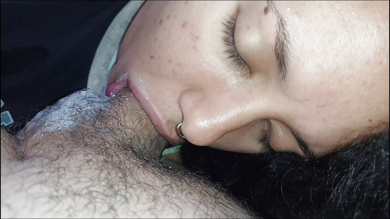 CLOSE UP OF THIS NERVOUS TONGUE, LICKING HER HARD COCK UP AND DOWN
