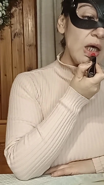 Maggy Applies Lipstick