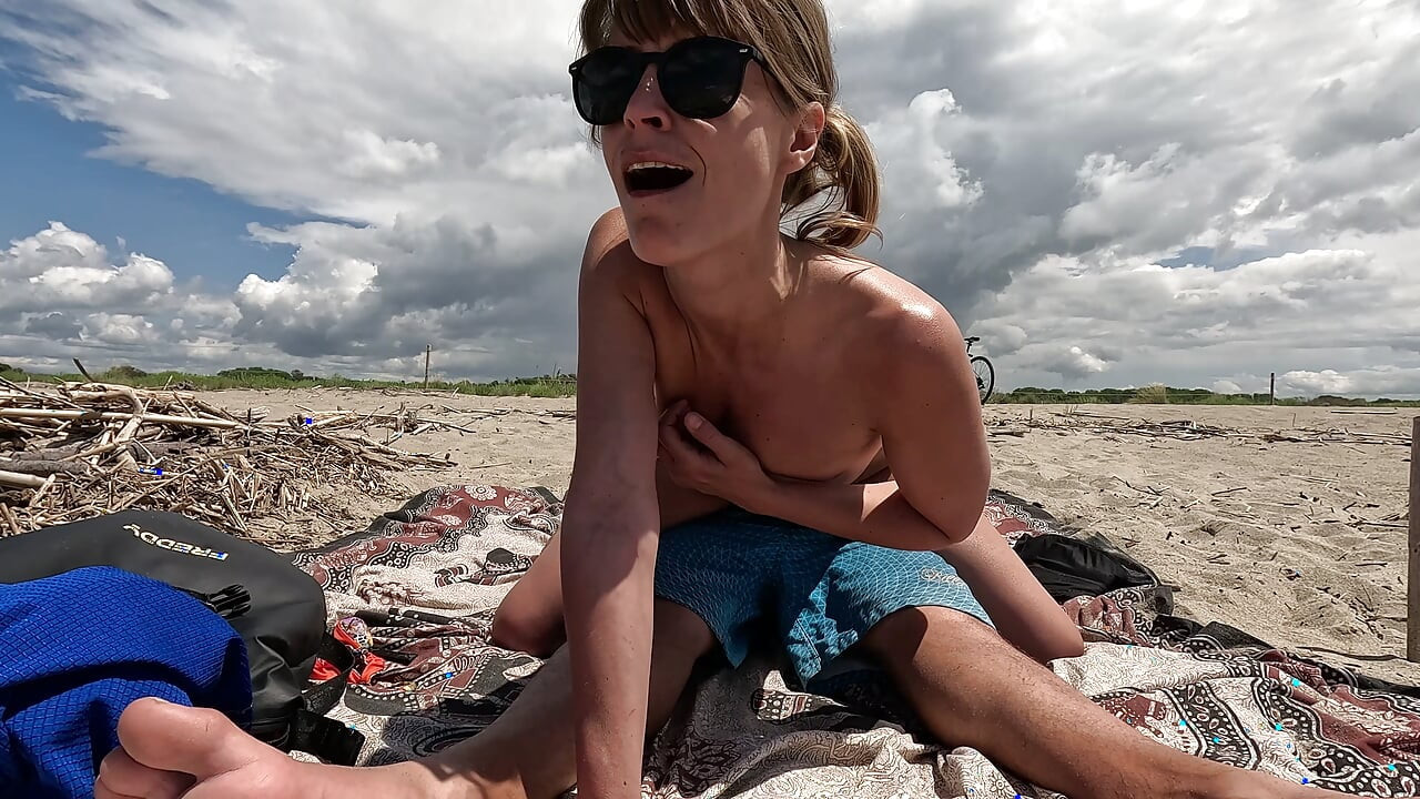 MILF Slut Topless Exhibitionist on the Beach, Teases Voyeur and Gets Fucked in Front of Everyone