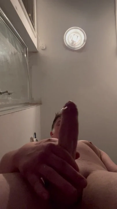 Young man cums in bathroom