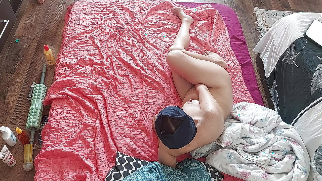 Sensual massage of a sexy couple with oil on the body. Foreplay in the bedroom with an amateur couple.
