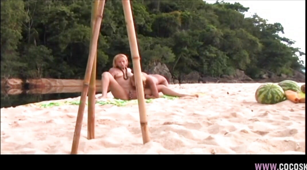 Blonde Lesbians Enjoy Intense Toy Play on Sunny Beach