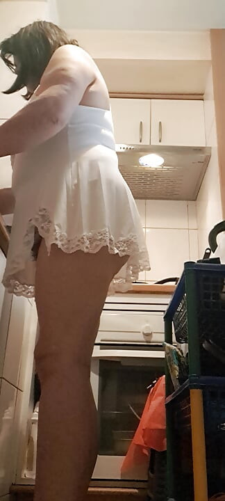 washing dishes without underwear and something small showing her pussy mom in the kitchen
