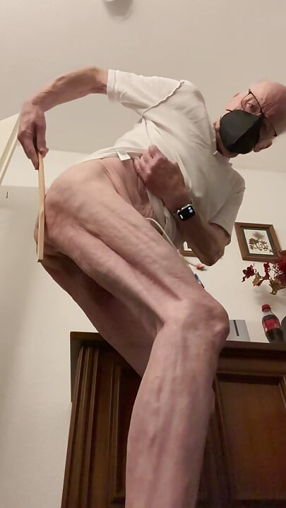 The old man punishes himself with his hand, with the stick, electric shock, self-punishment