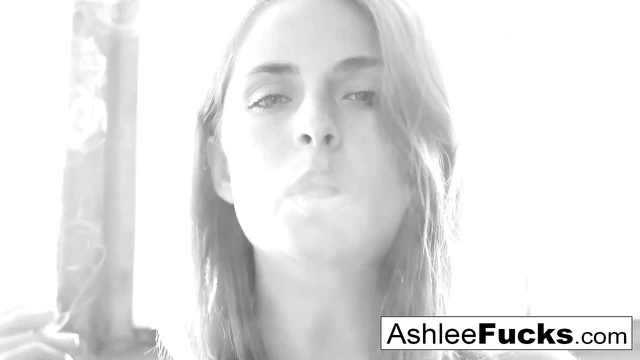 Busty Ashlee Graham smokes while showing off her natural tits