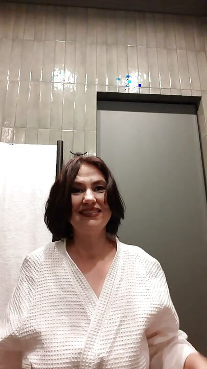 The lady washed in the shower and sat