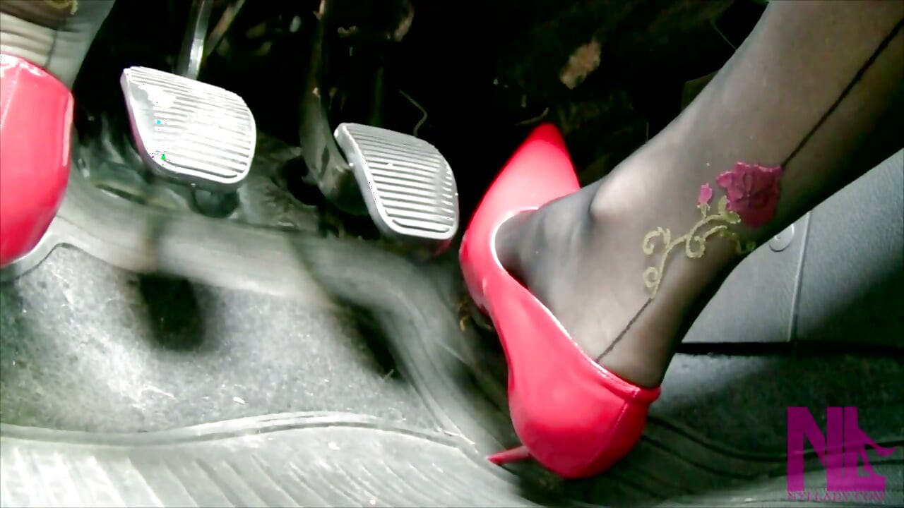 Driving in Scarlet Patent Pumps and Phillipe Matignone Rosed Stockings