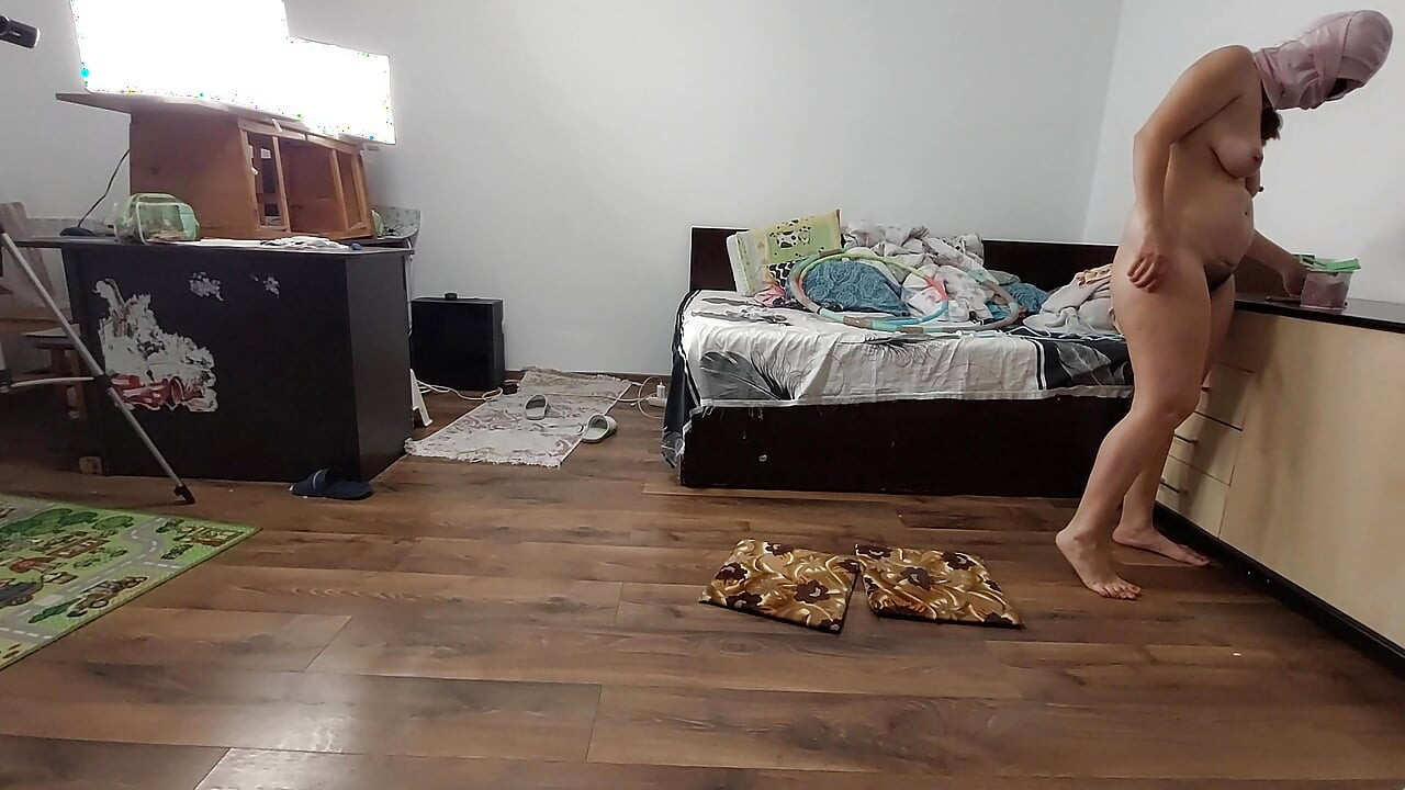 Sexy wife exercising naked at home. Sexy brunette tries on pantyhose, hairy pussy, big ass, big tits.