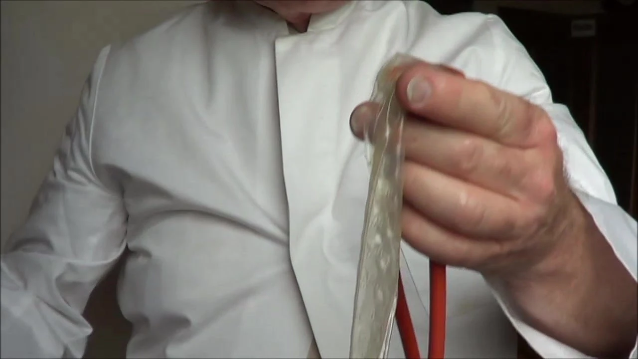 Sperm play with condom and stethoscope