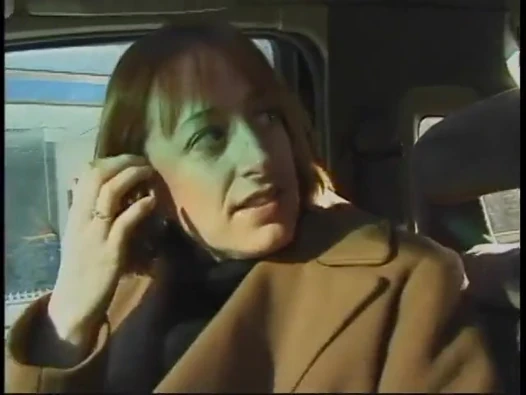 Commuter redhead carpools with creep who debases her in car in city traffic