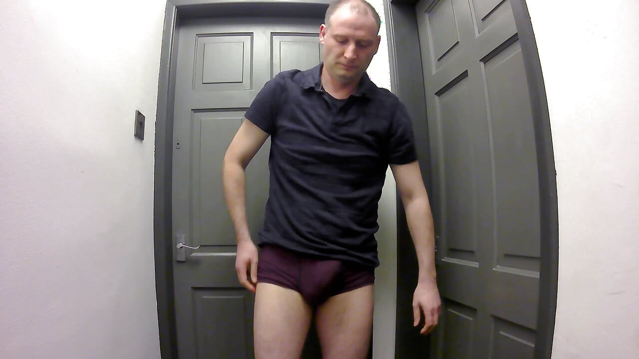 Jonathan gets out his erect shaved uncut cock as he strips naked masturbating
