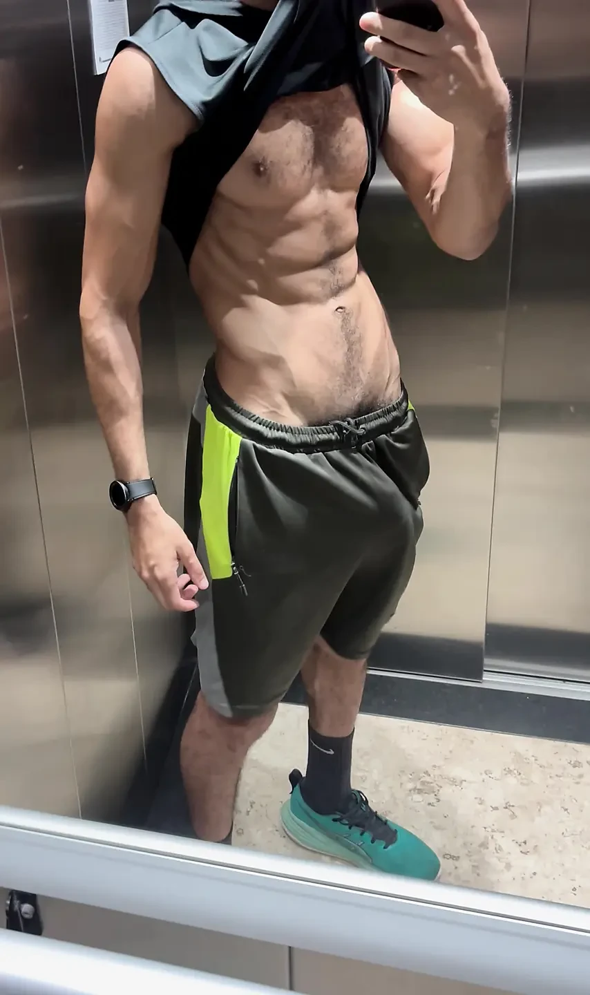 Hairy fitness guy showing off his thick cock in the elevator without underwear