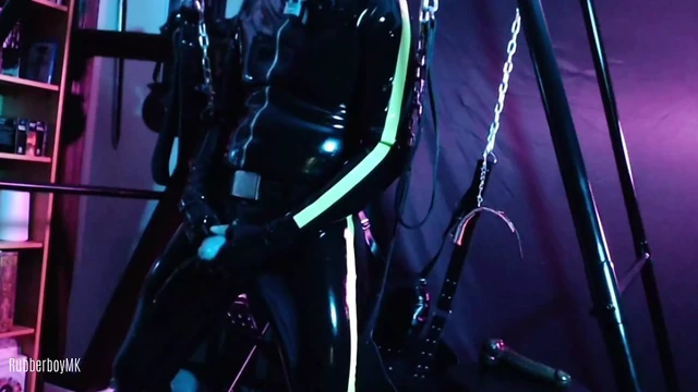 Rubberboy sex-toy-fuck and pissing in sling