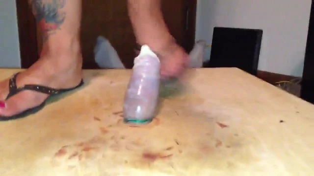 Trampling his poor cock in a condom