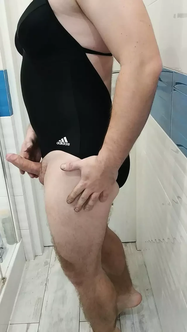Tranny wearing adidas one piece swimsuit