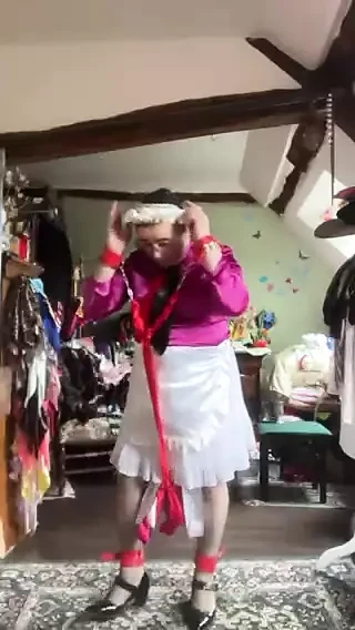 In a small white skirt chained