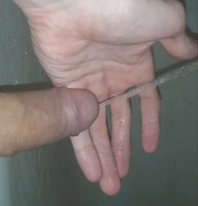 A young guy after a long abstinence wanted to pee and after solitude did pissing right on his hand and in the bath enjoy