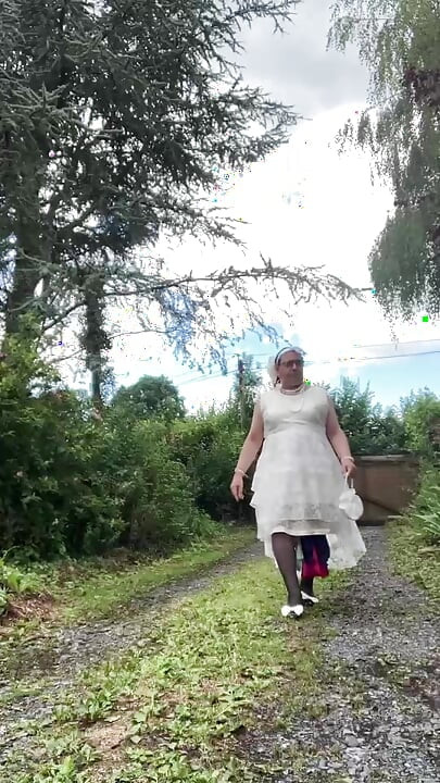 In an outfit with a long white dress for an evening.