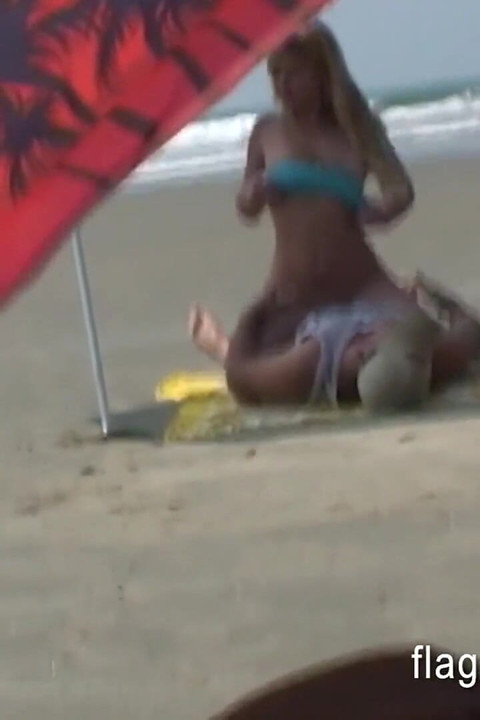 Brazilian couple having sex on the empty beach