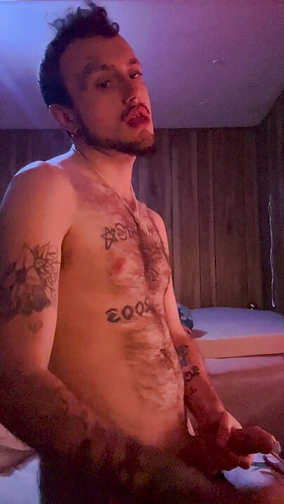 Tattoo stud playing with his cock