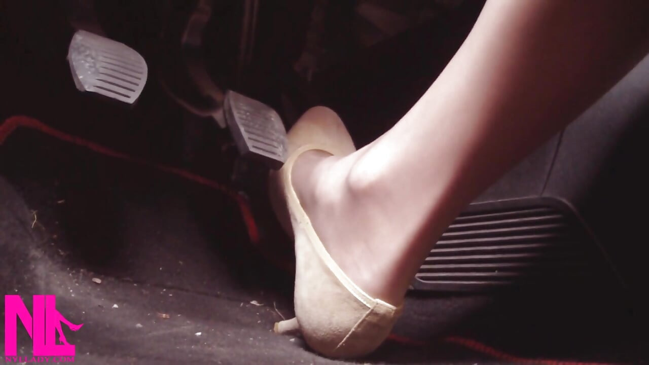 Driving Fast in Beige Pumps on Way to Airport