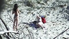 Young lezzies love oil massage on the beach