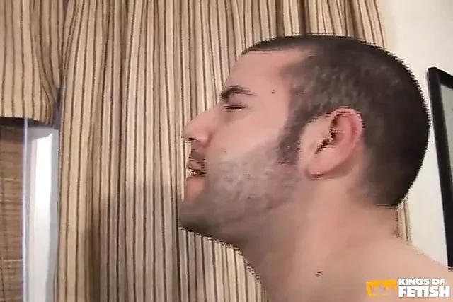Tattooed man gets his shaved asshole pumped by a younger dude with pierced balls