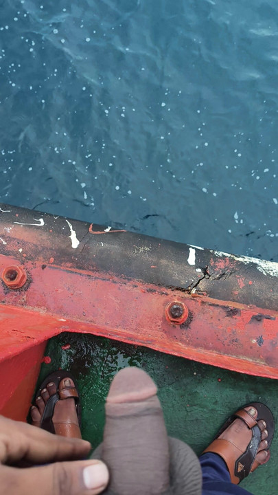 Peeing in the sea.