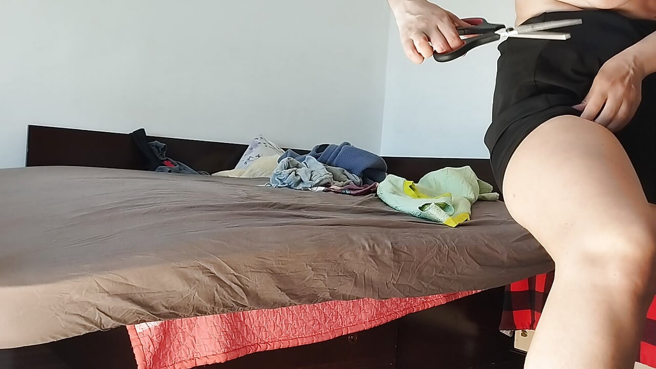 Amateur woman has fun trying on clothes and cutting them. Amateur woman vacuuming naked in the house.