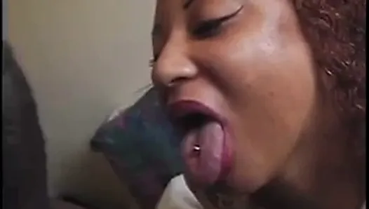 Curly-haired black chick gives black dude long wet blowjob and sucks his balls