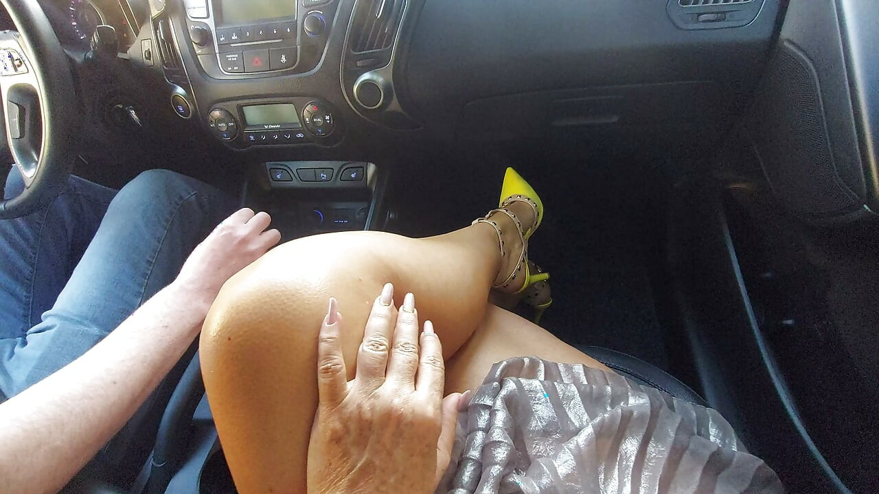 An elegant mature lady with beautiful legs in high heels seduces a taxi driver in the morning