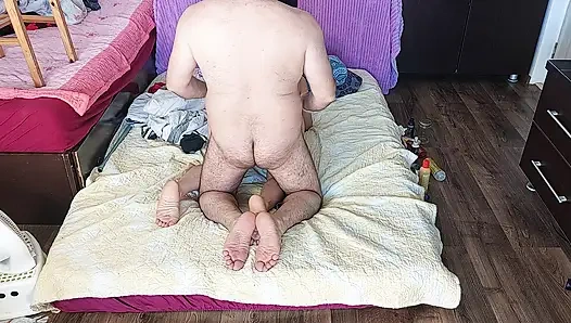 Sensual massage of a hot couple with oil on the body.