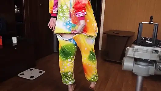 A baby in a unicorn costume shows off her ass