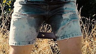 Scallyoscar piss drinking and soaking ripped denim shorts outdoor