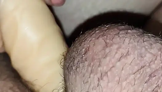 Pleasuring myself in his ass while jerking his cock!