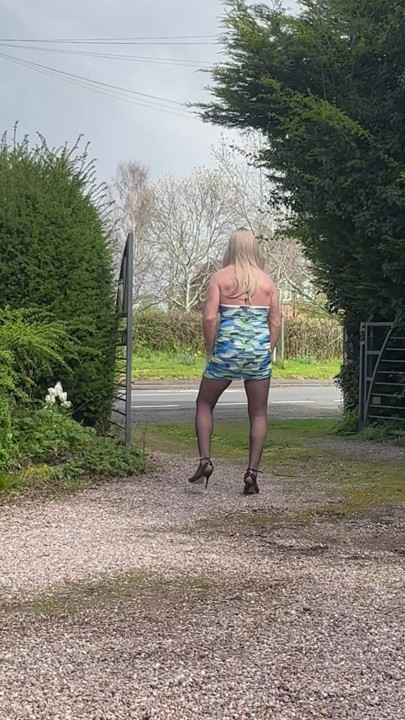 TV outdoors in Pantyhose and Heels