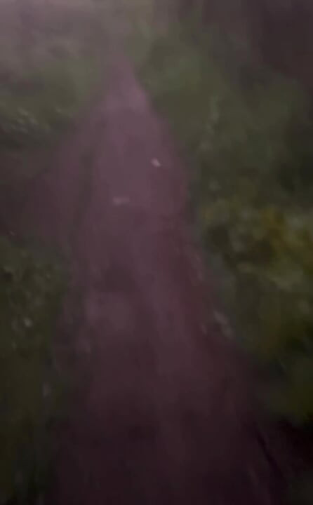 Long naked barefoot walk from car to a welcome to my town sign
